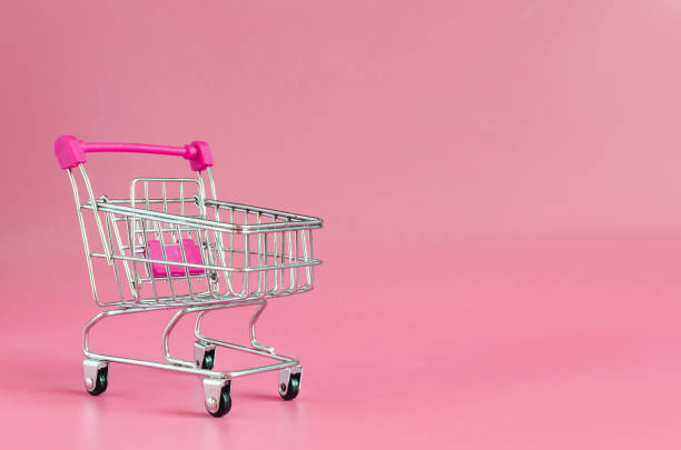 istock Red empty cart on red background close up trading concept 1289544729