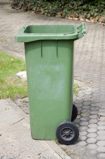 istock green plastic bin in nature garden 1289546189