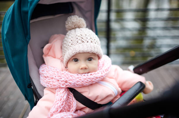 istock Baby in stroller on a walk in autumn park 1289546507