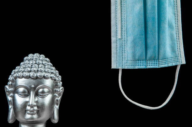 istock image of buddha mask dark background 1289548210