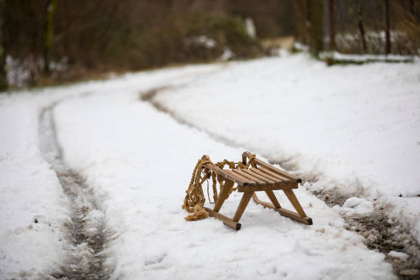 istock Sled on Dirt Road Covered With Snow 1289549967