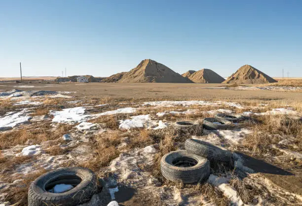 Gravel pit and old tires near the town of Beiseker, Alberta, Canada