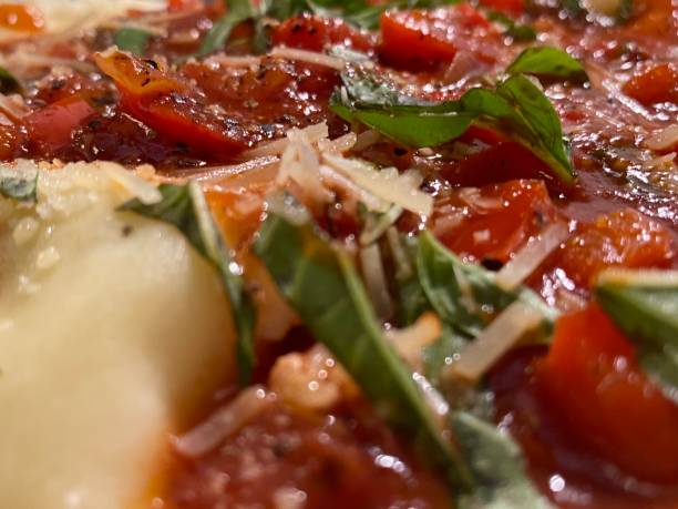 istock ravioli with red sauce, basil, and parmigiana cheese 1289553440