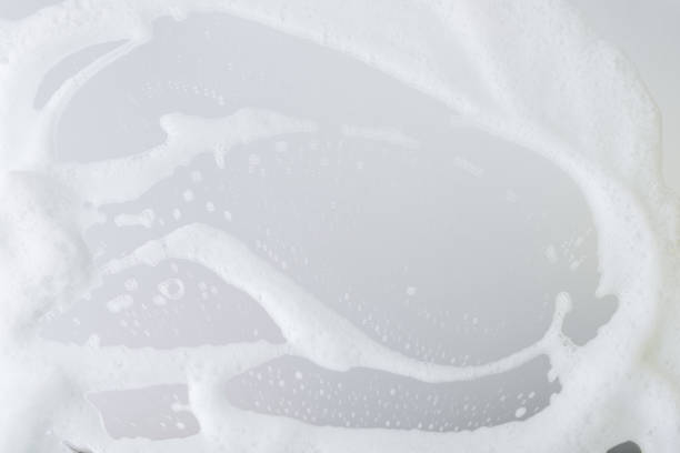 istock White foam smeared on the mirror close-up 1289553676