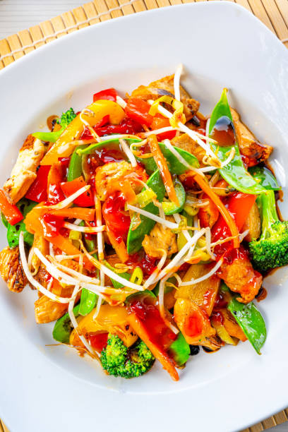 istock sweet and sour chicken with rice and vegetables 1289556718