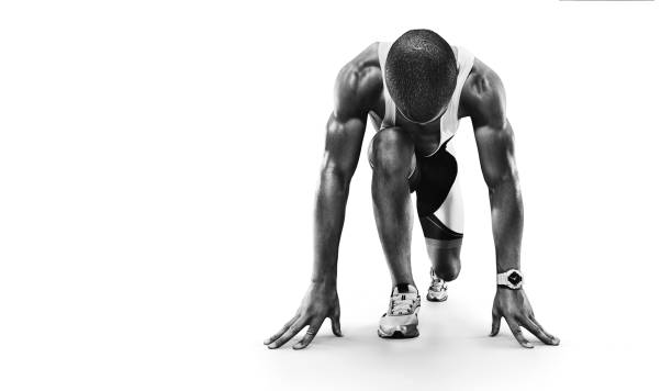 istock Sports background. Runner on the start. Black and white image isolated on white. 1289557583