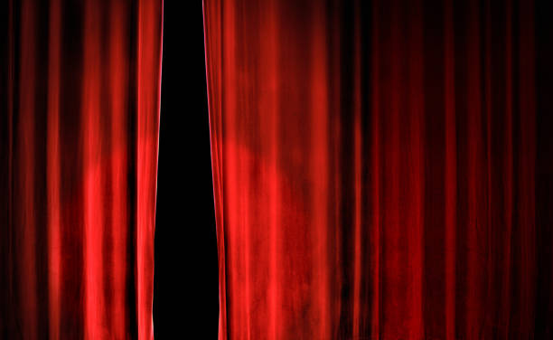 istock close up conceptual red stage curtain 1289559903