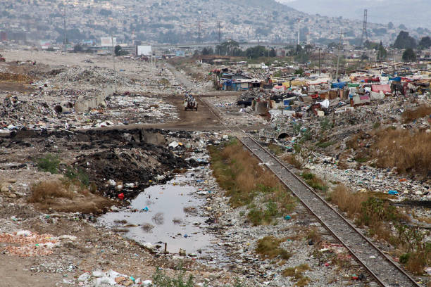 picture of landfill in latin America wide shot picture of Xochiaca former landfill in mexico city poverty mexico environment slum stock pictures, royalty-free photos & images
