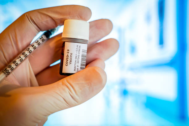 istock A creative image of a Covid-19 Vaccine bottle ready to be injected 1289560271