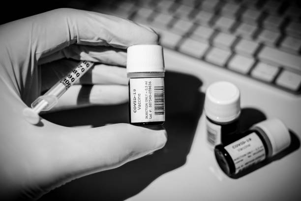A creative image of some Covid-19 Vaccine bottles ready to be injected