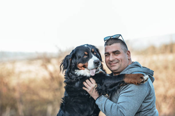 istock Man with his Bernese mountain dog 1289560394