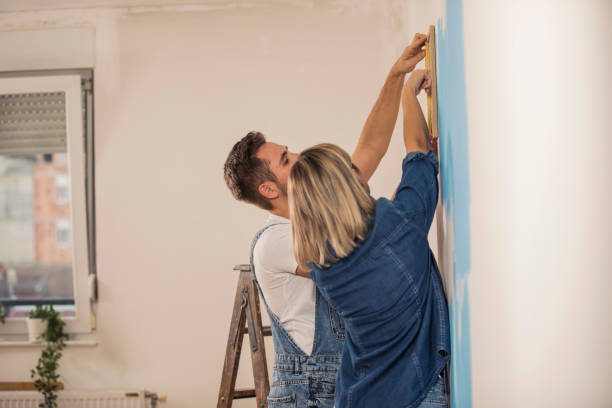 istock Copy space of young couple hanging picture frame 1289565293