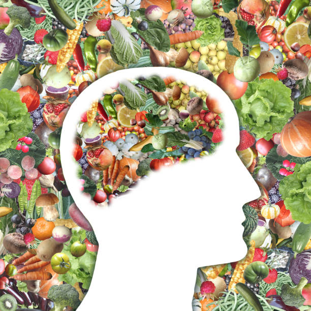 istock Organic Fruits and vegetables, around and inside human's brain profile 1289567323