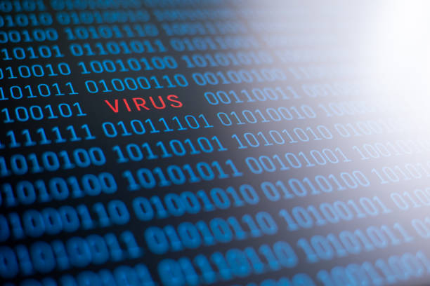 istock The word virus, written in red letters on a background of binary code in blue; white light on the right upper side. 1289569455