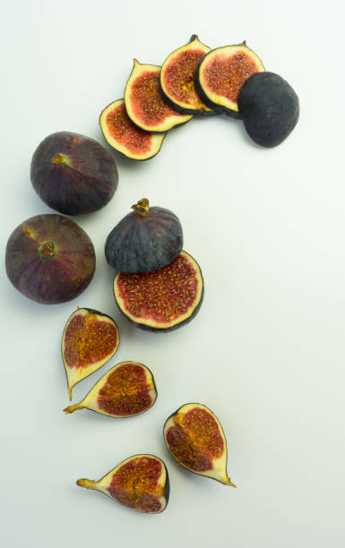 istock fresh juicy figs on white background 1289569728