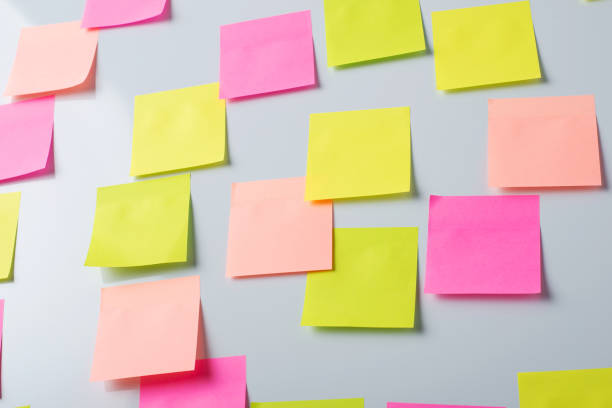 istock Colorful papers on a whiteboard for writing inscriptions and notes 1289570653