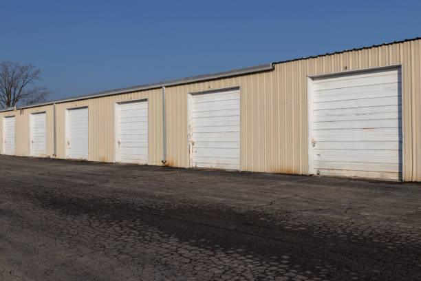 istock Self storage and mini storage garage units deserted, cold, and abandoned. 1289570861