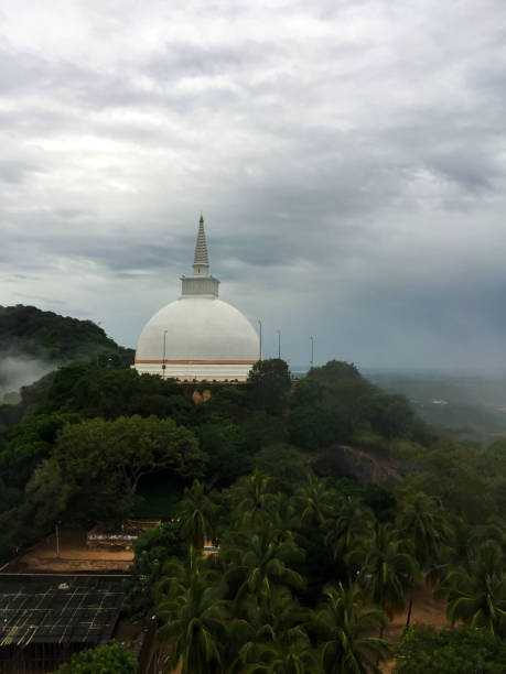 The Panorama View of Mihintale, Sri Lanka Mihintale, Sri Lanka- January 27, 2017: Mihintale is a historical site that is full of meaning and symbolism because the legend goes that Buddhism came to Sri Lanka through Mihintale. It also holds to be the landmark in the reception of Buddhism as a religion to Sri Lanka. Here is the panorama view of the mountain, the pagoda and the buddhism statue in Minhintale. mihintale stock pictures, royalty-free photos & images