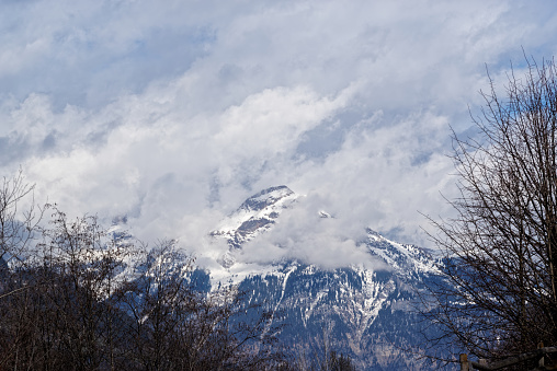 Panoramic view of snow covered mountain peak in clouds, Ziller Valley in Austria