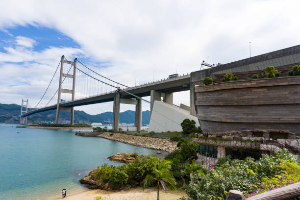 tsing ma double-decked suspension bridge and noah's ark, ma wan, hong kong - decked imagens e fotografias de stock