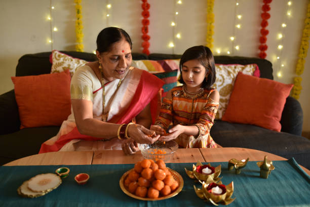 istock Girl helping Grandmother in kitchen 1289574939