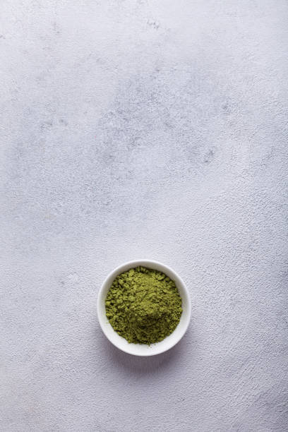 istock Matcha with milk in a glass on a light background 1289578174