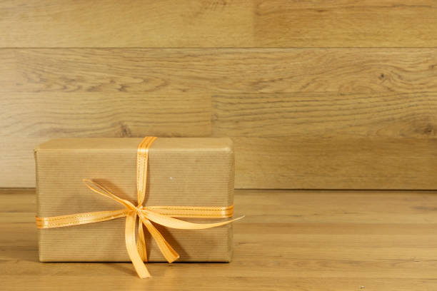 istock Christmas gift box on wooden table 1289578183