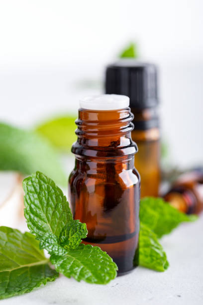 istock amber bottles with fresh mint leaves 1289578299