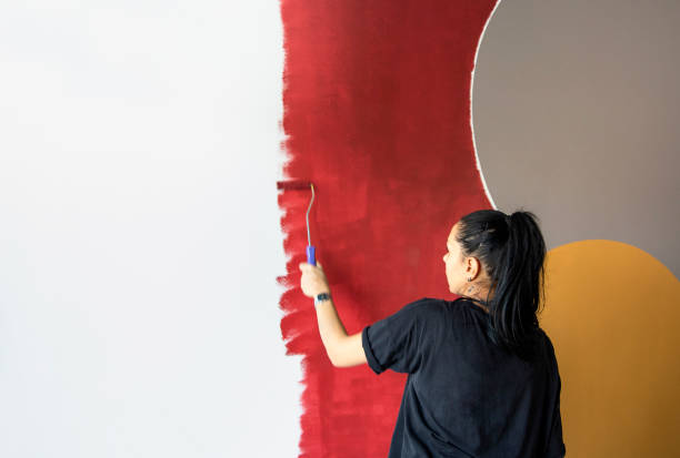 istock Woman doing diy project in apartment 1289579227