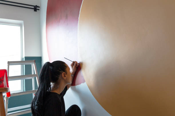 istock Woman doing diy project in apartment 1289580710