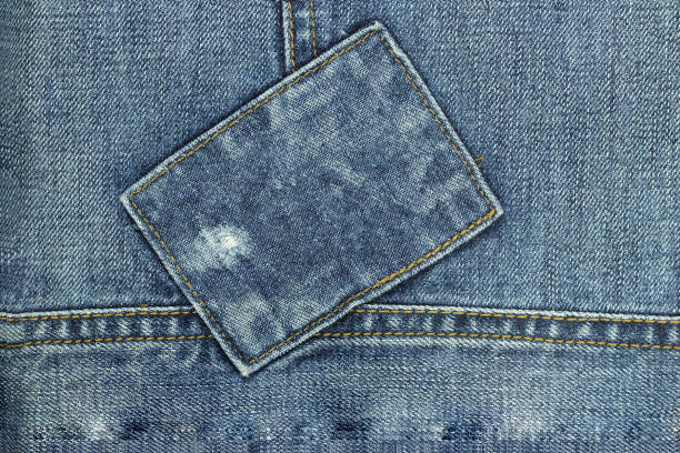 Denim rectangular patch with copy space. Denim background with rectangular patch copy space. hole in pants stock pictures, royalty-free photos & images