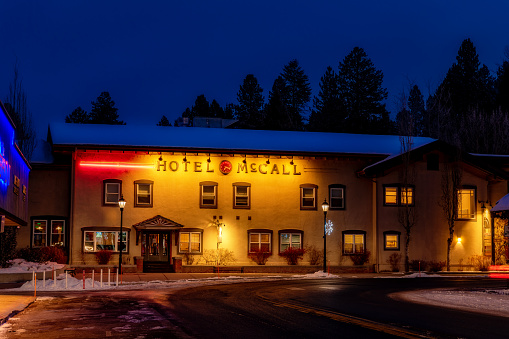 McCall, Idaho, USA –November 28, 2020: Warm colors paint the side of a hotel at night in McCall Idaho in winter