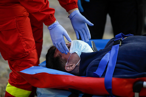 Bucharest, Romania - December 5, 2020: Paramedics from the Romanian Ambulance (SMURD) exercise the rescue of a car crash victim.