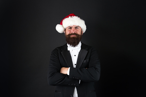 Man bearded hipster wear santa hat. Christmas spirit concept. Financial report. Manager ready celebrate new year. Christmas party office. Corporate holiday party ideas. Corporate christmas party.