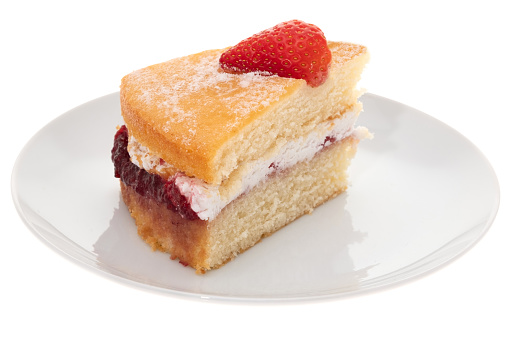 A slice of Victoria sponge cake - white background