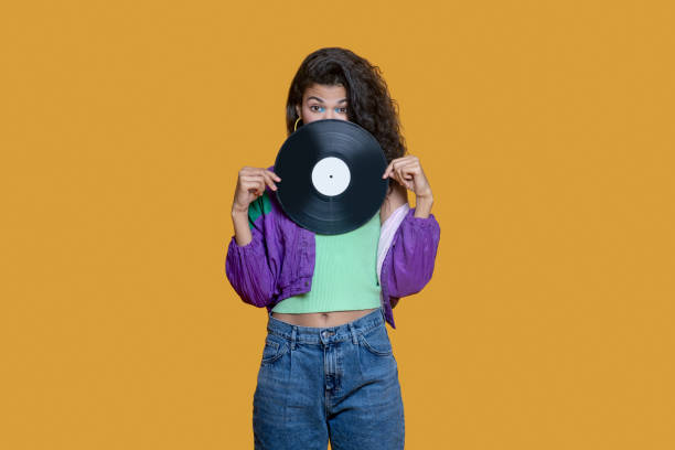istock Cute dark-haired young girl holding a record 1289594461