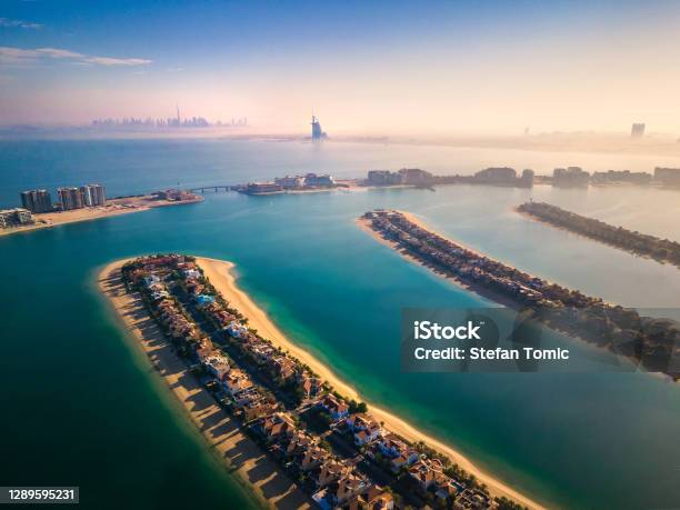 The Palm Jumeirah Island With All Dubai Landmarks In The Background Aerial View Stock Photo - Download Image Now
