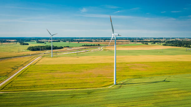 istock Two wind turbines on field in Poland, view from above 1289598304