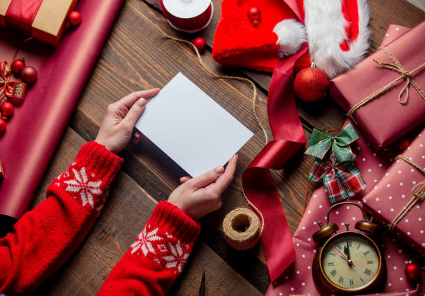 istock Woman hold mail in envelope on wooden table in wrapping time 1289599585