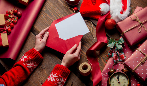 istock Woman hold mail in envelope on wooden table in wrapping time 1289599625