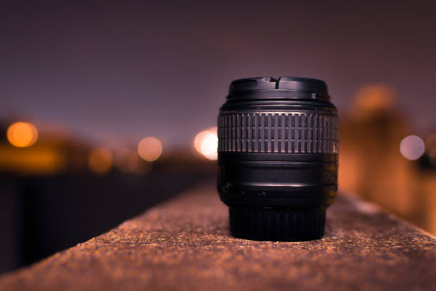 Camera lens with blurry background and bokeh of lights