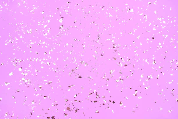 istock Festive background in pink color with holographic flying silver sparkles for your project. Holiday backdrop with copyspace. Birthday party, Christmas or New Year celebration concept 1289605941