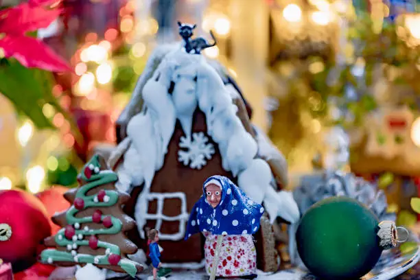 Gingerbread house Hansel and Gretel with Christmas decorations and bokeh