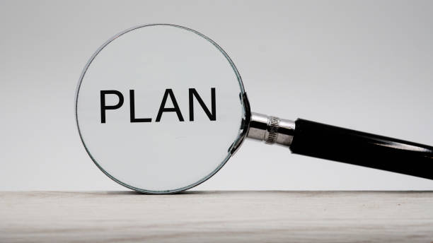 istock Magnifying Glass over the red word plan 1289606838