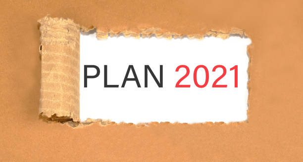 istock Plan word inscription on torn cardboard.. on white background 1289606839