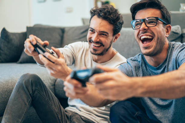 istock Excited friends playing video games 1289609640