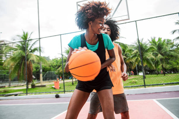 istock Friends playing basketball 'one on one' 1289610590