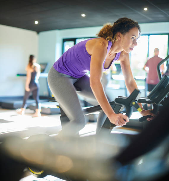 istock spin cycling at the gym 1289611931