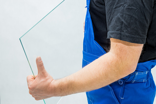 A worker holding a glass in his hands