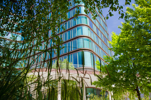 Modern, eco-friendly office building exteriors where sustainable lifestyle and green trees are a central part of the modern architecture in downtown Copenhagen.